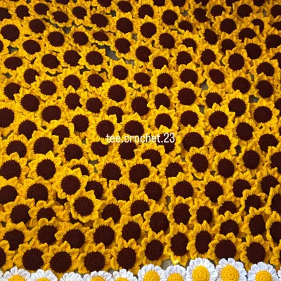 A sea of sunshine. This is a close-up of hundreds of my handmade sunflower and daisy keychains, part of a 700-piece wholesale order.