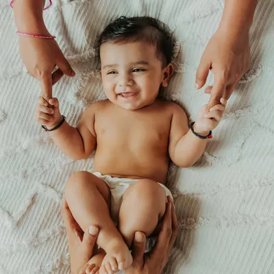 This is the kind of pure, simple joy I aim to capture in every family photography session. This little one's beautiful smile, held securely by his parents' hands, is a perfect example of a timeless memory turned into art. It’s these tiny, fleeting moments that become our most treasured family heirlooms.