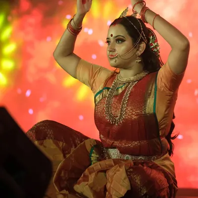 A powerful pose from a dance drama, where the makeup helps bring the character of 'Draupadi' to life. The look is designed to be expressive and dramatic.