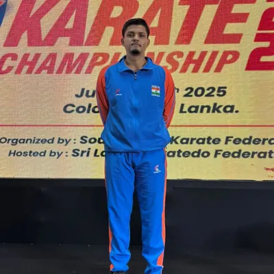 Jitendra Kumar representing India at the 9th South Asian Karate Championship in Colombo, Sri Lanka. His focus and preparation are evident before the match.