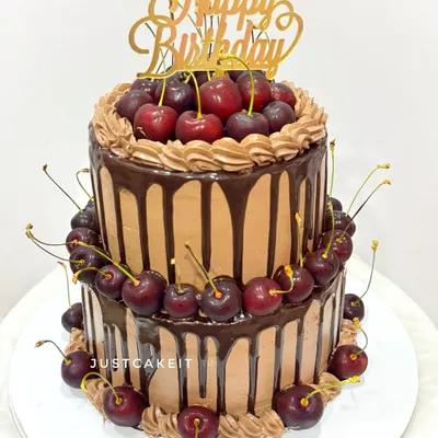 A last-minute, two-tier chocolate cake absolutely loaded with fresh cherries. I was so impressed that my client dared to take this tall cake in an auto rickshaw, and it arrived perfectly.
