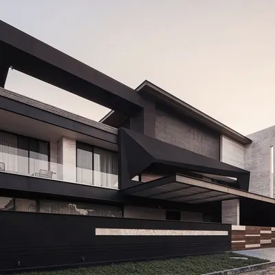 The Carbonado residence in Panipat, seen here at dusk, showcases our use of bold, angular forms and dramatic lighting. Inspired by the black diamond, its design is a play of solid and void, creating a powerful silhouette that is both sleek and imposing.