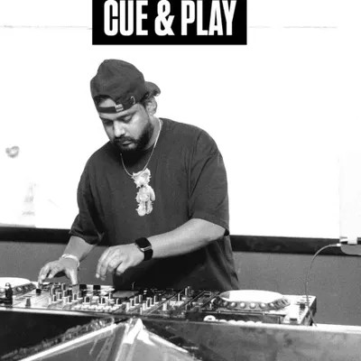 A black and white shot showing the "Cue & Play" moment. This is where the magic starts, lining up the next track to create a smooth transition.