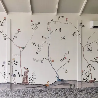 This expansive French-themed mural, painted in a villa in Tirupur, Tamil Nadu, brings the tranquility of nature indoors. The design features delicate branches, birds, and flowers, creating a serene and elegant atmosphere.