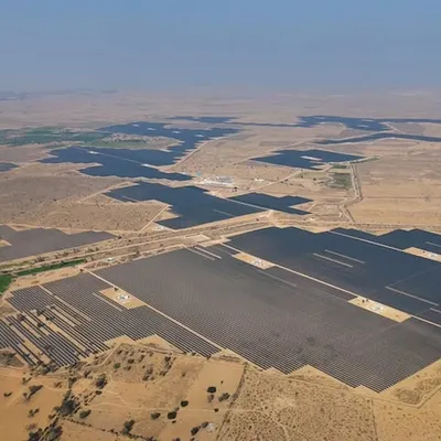 An expansive aerial view of our pioneering open-access solar plant, Project JAI, connected to the national grid. This facility is engineered to provide businesses across India with access to renewable energy, irrespective of their geographical location.