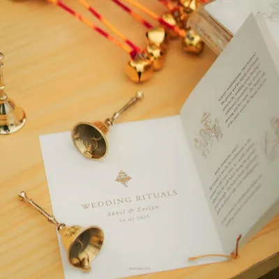 An intimate guide to a lifetime of togetherness. We created these beautiful booklets explaining the wedding rituals, complete with small bells for guests to ring, making the ceremony interactive and meaningful for everyone.