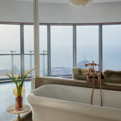 The pièce de résistance in this young lady's bedroom is the freestanding British tub overlooking the Mumbai cityscape. It adds a touch of unexpected luxury, transforming the room into a sophisticated and indulgent personal suite.