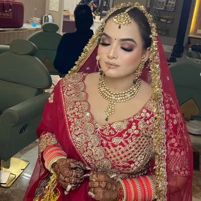 My beautiful bride Dipika, looking absolutely regal. For her wedding day, we created a classic bridal look with soft brown smokey eyes and a flawless base to complement her stunning red lehenga.