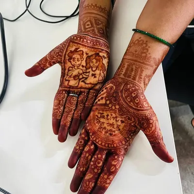 The beautiful, rich stain of a personalized Rakhi mehndi. This design features a cartoon of a brother and sister, along with a loving message, creating a cherished memory.