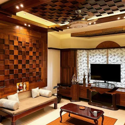 This living room in Hubli is designed for warmth and richness, using extensive wood paneling. The coffered ceiling and the checkerboard-patterned feature wall create a classic, sophisticated space for relaxation and entertainment.