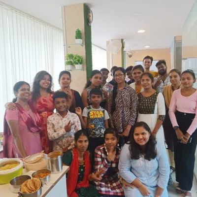 A happy group photo from one of our potluck events, featuring students of all ages, including our young learners. These gatherings are perfect for building a supportive and interactive learning community.