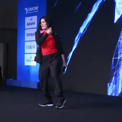 Taking the stage for a major Danone corporate event. I love commanding a large audience and creating a shared energy that fills the entire venue.