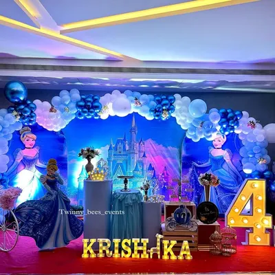 A magical Cinderella theme for Krishaka's 4th birthday. We created a stunning blue castle backdrop, complete with princess cutouts, a carriage-style cart, and marquee letters for a truly royal celebration.