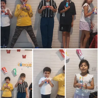 Glimpse of our session where kids made their own little robots from upcycled materials. They are proudly holding their creations, which they also named themselves!