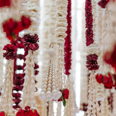 A close-up of the fragrant floral strings, or 'ladis', from the 'Laal Ishq' wedding. We used thousands of rajnigandha, mogra, and roses, a detail that speaks to the heart of traditional Indian wedding decor and craftsmanship.