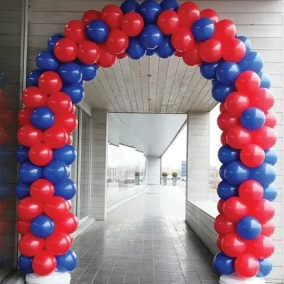 A classic spiral balloon arch in red and blue. This type of arch is perfect for marking the entrance to a party or corporate event.
