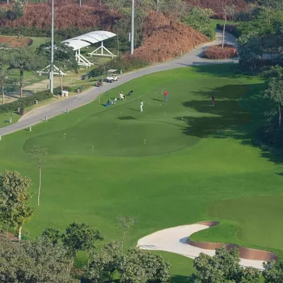 An Aerial View of the DLF Golf Academy: Our world-class facilities provide the perfect environment to elevate your game. This view showcases our expansive driving range and practice greens, designed for every skill level.