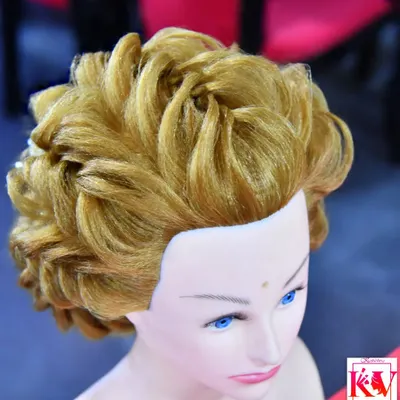 An example of an advanced Western-style updo taught in my international hairstyling classes. This voluminous, curled style is perfect for a reception or engagement party.