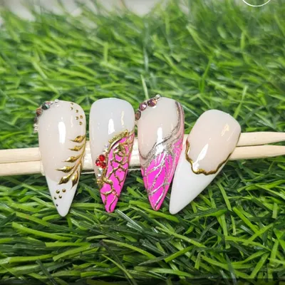 This set showcases creative variations on the classic French manicure. We've combined it with techniques like snakeskin texture, gold chrome lining, and rhinestone accents for a modern, edgy look.