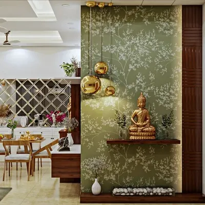 We designed this elegant foyer corner to separate the dining area while adding a touch of tranquility. The design uses a beautiful floral wallpaper, hanging golden globe lights, and a simple wooden shelf for a Buddha statue, creating a warm and spiritual welcome.