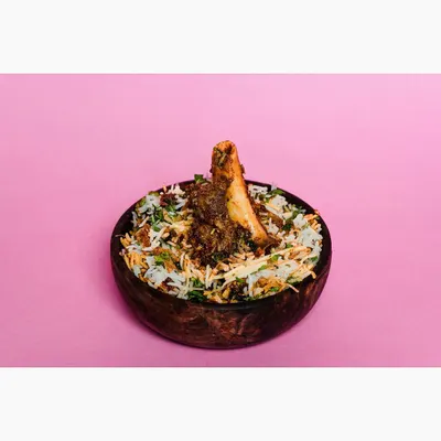 A bowl of mutton biryani shot against a vibrant, solid pink background. This modern, high-contrast style is designed to grab attention on crowded food delivery apps.