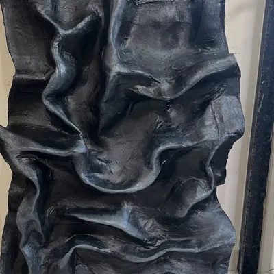 This 3D sculptural piece, with its deep, flowing folds, took almost five months to perfect. It was created for a special client in Kanpur and shows how texture can create a powerful, dramatic statement.