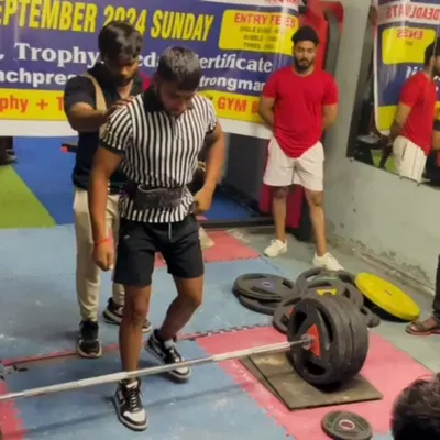 Guru ji. A student prepares for a heavy deadlift at a competition, a moment where all the training comes together.