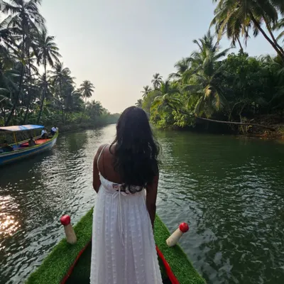 A serene moment on a boat in the beautiful backwaters of Honnavara. This mangrove forest is a hidden gem on our coastal Karnataka tour.