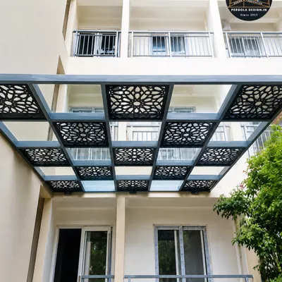 This entrance canopy showcases our custom laser-cut design capabilities. The decorative panels add a layer of visual interest and partial shade, transforming a functional structure into a piece of architectural art.