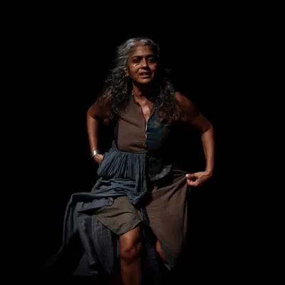 A haunting moment from our solo production of "Medea." The play uses stark visuals and a powerful performance to explore the depths of a woman's despair in the face of exile.