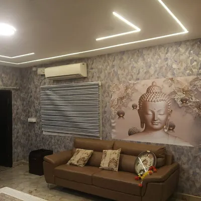 This is a zebra blind I installed in a living room, paired with a custom wallpaper. The alternating sheer and solid bands allow for adjustable light filtering, which is ideal for common areas.