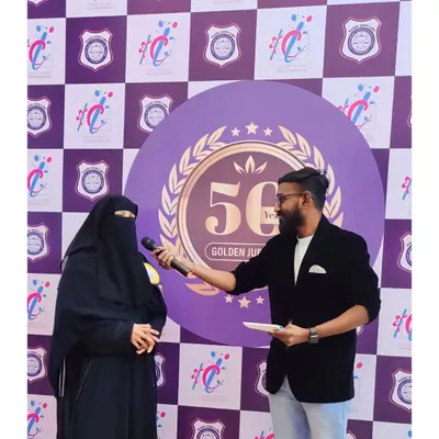 Our event host in action, making sure every guest feels included. We provide professional emcee services for all types of events, from corporate functions to family celebrations like this golden jubilee.