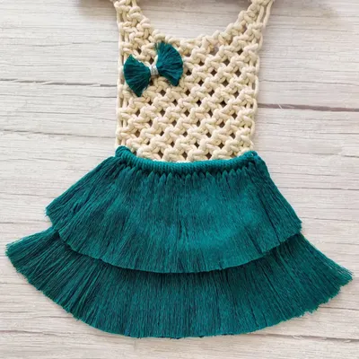 I love getting custom orders for baby room decor. I made this adorable macrame dress wall hanging for a baby girl whose mother loves all things handmade. The teal skirt and little bow are so sweet.