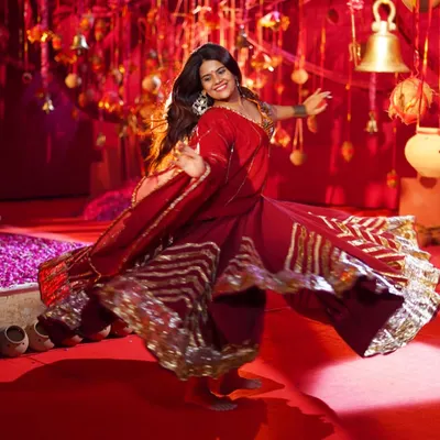 Another powerful shot from the 'Norta Aave' music video set. The beauty of Garba is in the details, from the flowing ghagras to the synchronized movements of the entire group.
