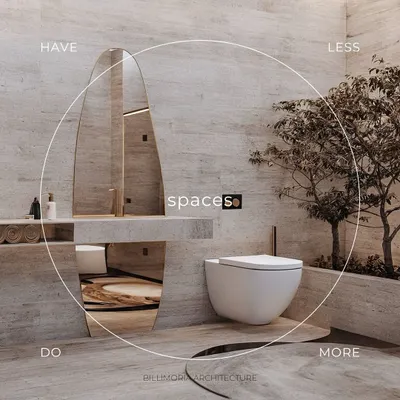 This minimalist bathroom is a study in tranquility, using floor-to-ceiling travertine stone. An organically shaped mirror and a small indoor tree bring natural elements into the space, creating a spa-like feel.