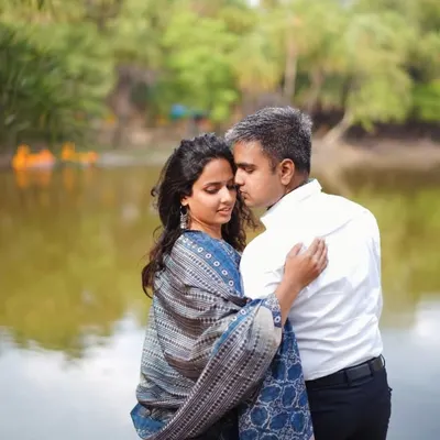 A romantic moment from our pre-wedding shoot. I chose a beautiful printed shawl to add a touch of traditional elegance to my simple blue and white outfit, coordinating perfectly with my husband's classic white shirt.