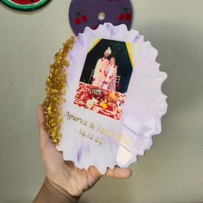 A custom resin couple frame made for Apurva and Sanchita. This piece features their wedding photo, names, and special date, set in a beautiful lilac resin with a gold rock edge.