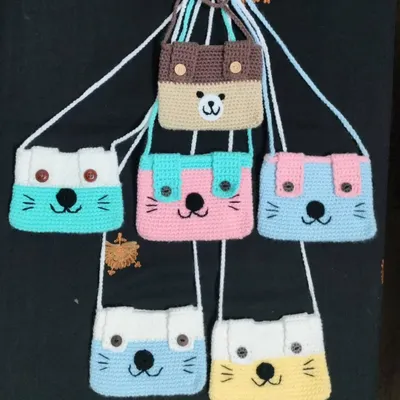 My collection of handmade cute bags for kids. I make them with different animal faces like cats and bears, and in many colours. They are the perfect size for children to carry their small things.