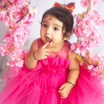 A little princess in pink. This floral swing setup is perfect for creating dreamy, fairytale-like portraits for your baby girl.