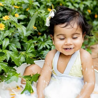 Splish, splash, and a whole lot of smiles during this summer milk bath session. These are perfect for babies who can sit up and love to play in the water.