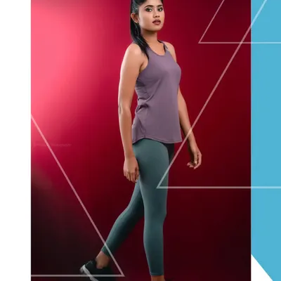 A studio shot for a fitness apparel brand, featuring a model in motion against a bold red background. The graphic overlay adds a modern, branded touch.