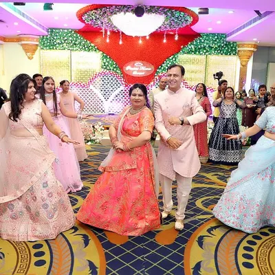 A beautiful moment captured during a family dance performance, with the parents in the center. We design formations that put the most important people in the spotlight.