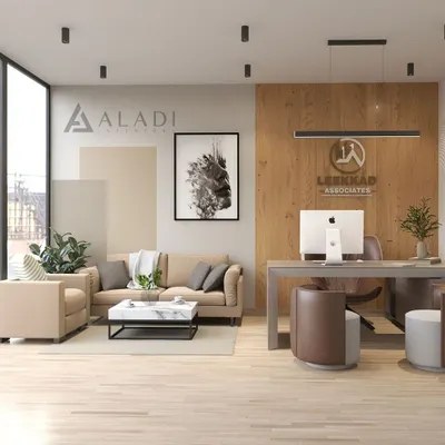 A wide view of a modern office reception and meeting area, designed with natural wood panels, comfortable seating, and prominent company branding to welcome clients.