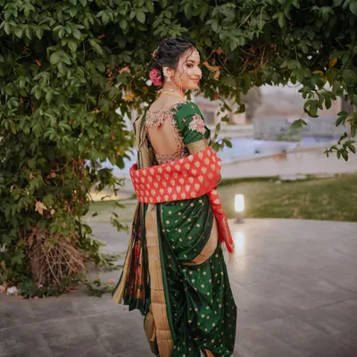 A back shot of my beautiful Maharashtrian bride Vaishnavi. The traditional green Navari saree with the intricate blouse and classic bun adorned with flowers is a look I will always cherish creating.