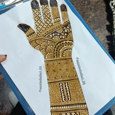 Practice makes perfect. Here is a full Indian mehendi design sketched out on paper, allowing me to refine the patterns before applying them to skin.