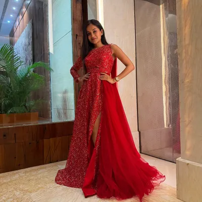 A full-length shot of my show-ready look in a sparkling red gown. I believe that looking the part is key to setting the right tone for a glamorous evening event like a gala or awards ceremony.