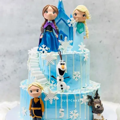 This Frozen-themed cake features all the main characters as detailed, edible figurines. I created a winter wonderland with a two-tiered structure, complete with a castle staircase and delicate snowflakes.