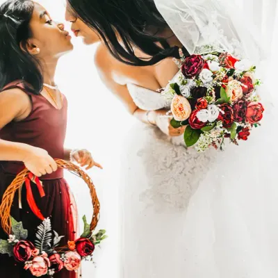 A sweet kiss between the bride and her flower girl. The innocence and love in this moment is what makes having kids at weddings so special.