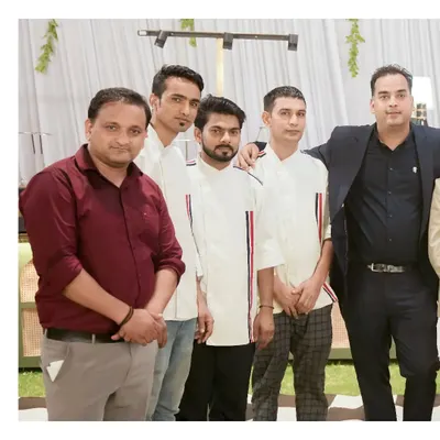 A group photo of our professional service and management team at an event, ready to ensure a seamless experience for our clients.