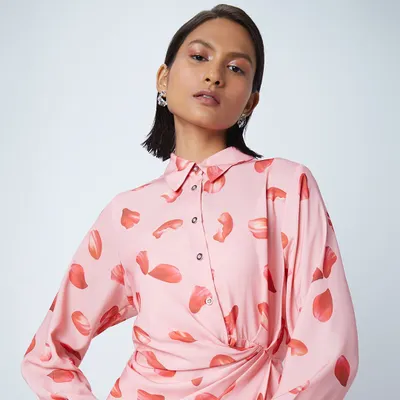 A soft, pretty makeup look for a Westside fashion shoot. The glossy eyes and pink tones complement the printed dress, creating a fresh and modern feel.